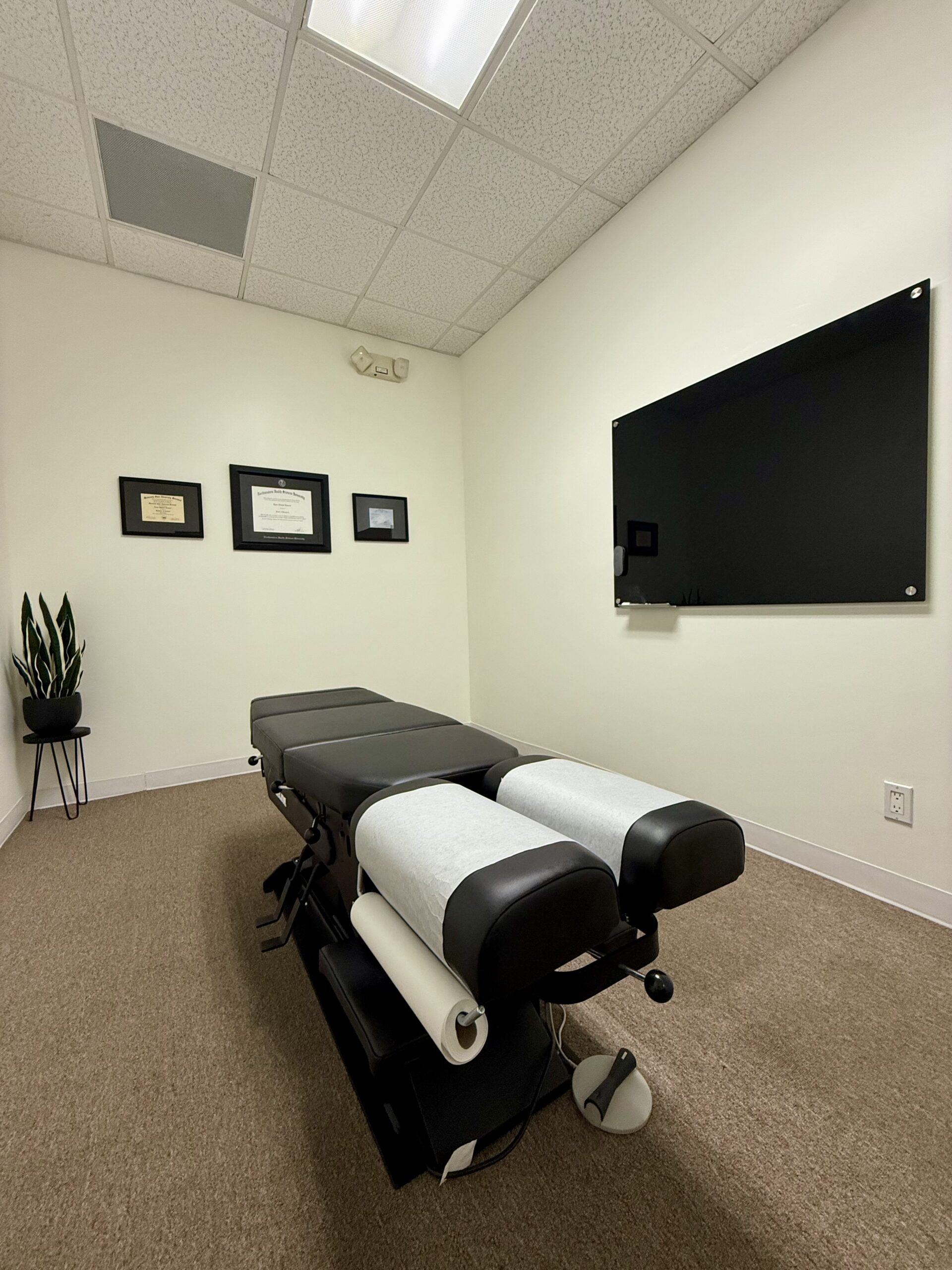 A bright, welcoming adjusting room at Leonard Chiropractic